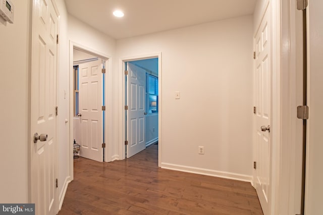 hall with dark hardwood / wood-style floors