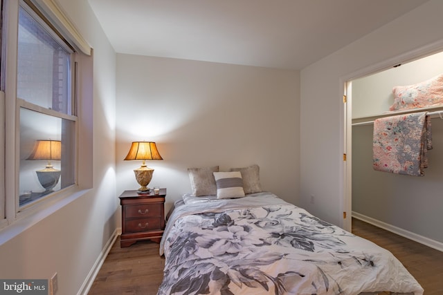 bedroom featuring dark wood-type flooring