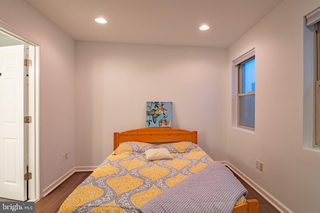 bedroom featuring dark hardwood / wood-style flooring