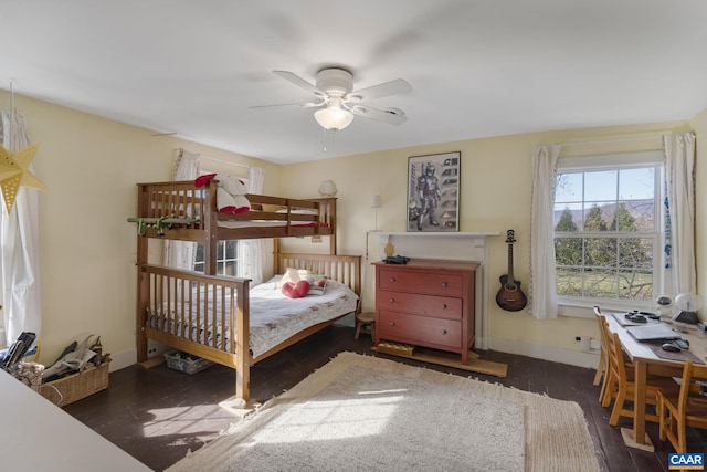 bedroom featuring ceiling fan and dark hardwood / wood-style flooring