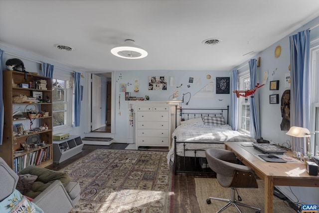 bedroom featuring dark hardwood / wood-style flooring