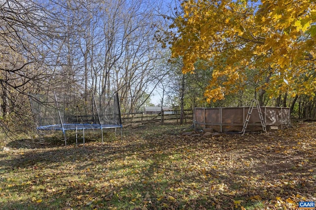 view of yard with a trampoline