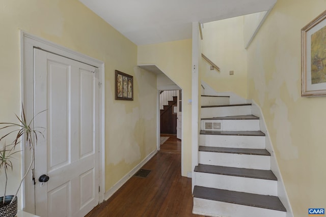 stairway featuring hardwood / wood-style floors