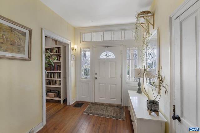 foyer entrance featuring dark hardwood / wood-style floors