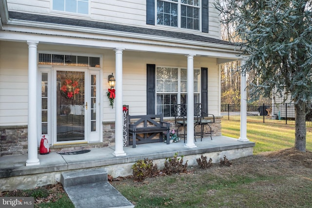 doorway to property featuring covered porch