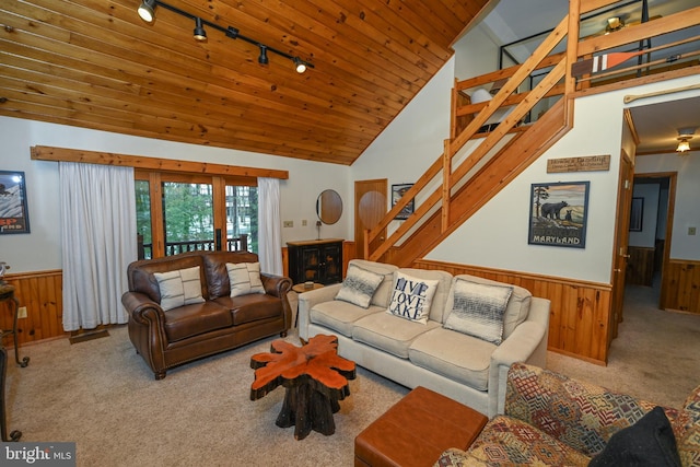 living room featuring carpet, wooden ceiling, high vaulted ceiling, track lighting, and wooden walls