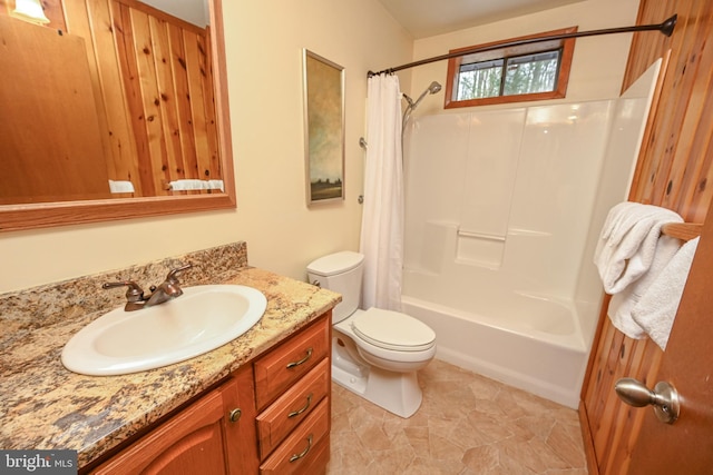 full bathroom featuring vanity, toilet, and shower / tub combo with curtain