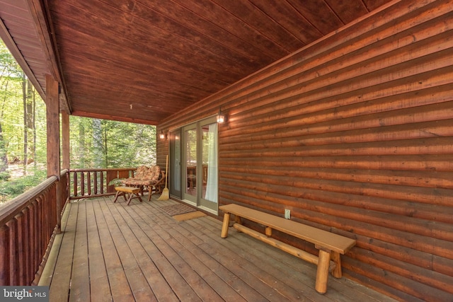 wooden terrace featuring a porch