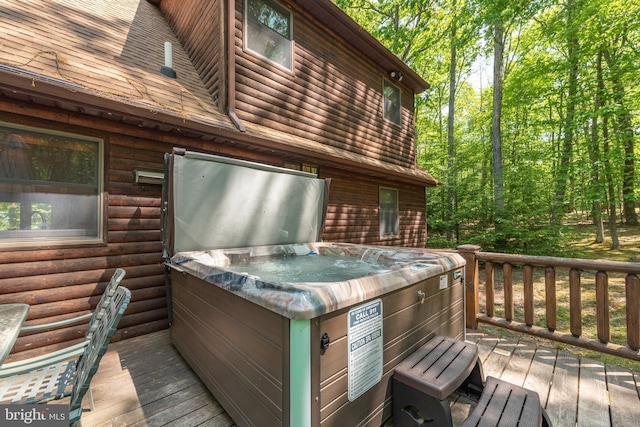 deck featuring a hot tub