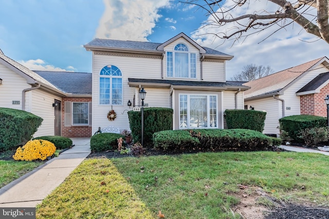 view of property featuring a front yard