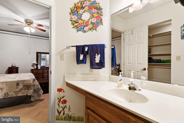 bathroom featuring ceiling fan and vanity