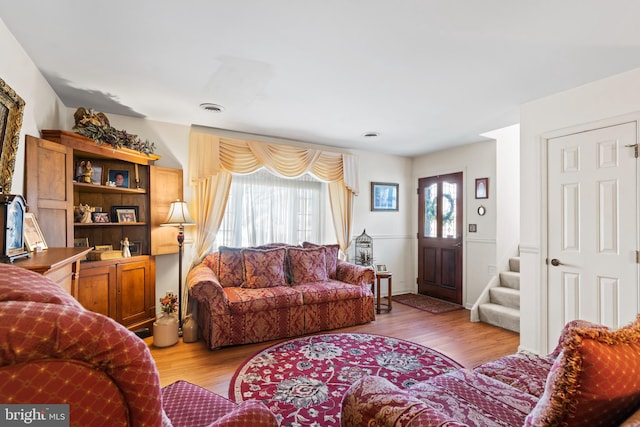 living room with light hardwood / wood-style flooring