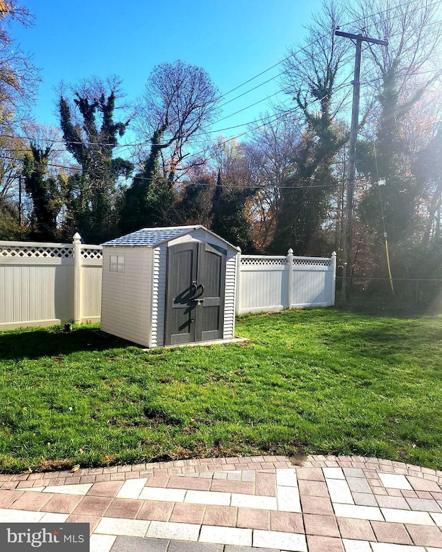 view of shed with fence