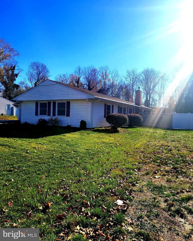 view of front of property with fence and a front yard