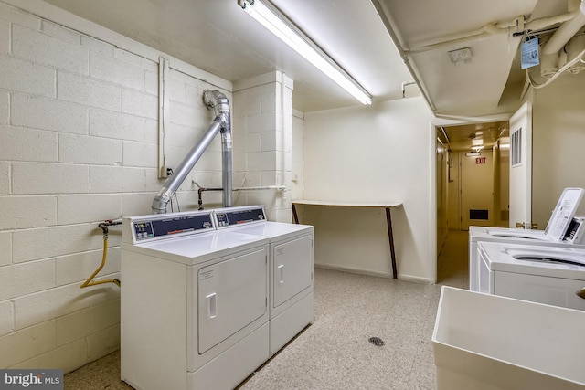 laundry area with separate washer and dryer