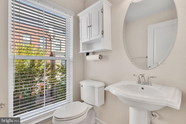 bathroom featuring toilet and sink