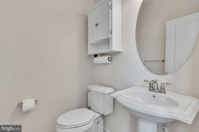 bathroom with toilet and sink