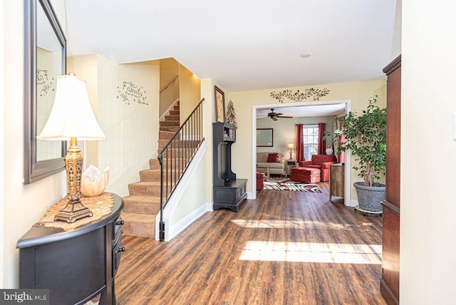 foyer featuring ceiling fan and dark hardwood / wood-style flooring