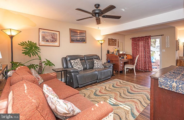 living room with beamed ceiling, ceiling fan, and dark hardwood / wood-style flooring