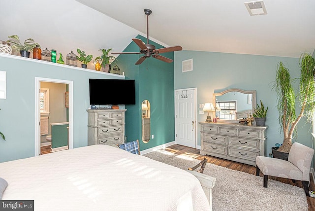 bedroom with ceiling fan, ensuite bathroom, high vaulted ceiling, and light hardwood / wood-style floors