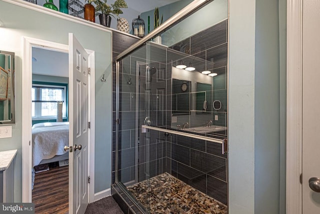 bathroom with wood-type flooring and walk in shower