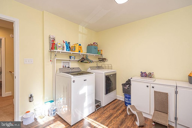 laundry room featuring separate washer and dryer and dark hardwood / wood-style floors