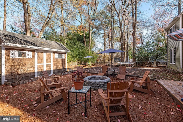 view of patio with a fire pit