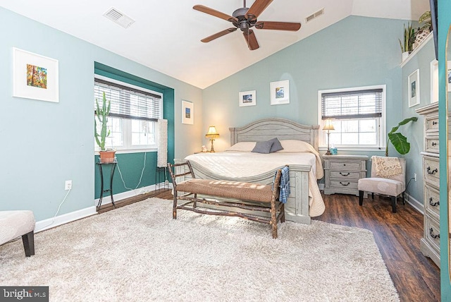 bedroom with dark hardwood / wood-style floors, ceiling fan, and lofted ceiling