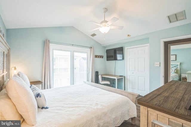 bedroom featuring access to outside, vaulted ceiling, hardwood / wood-style flooring, ceiling fan, and a closet