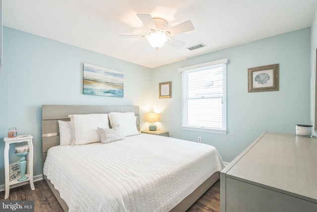 bedroom featuring ceiling fan and dark hardwood / wood-style floors