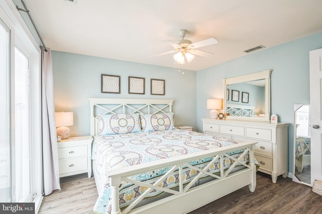 bedroom featuring light hardwood / wood-style flooring and ceiling fan