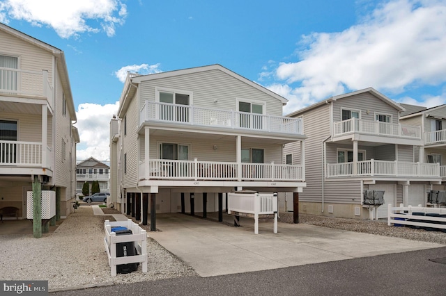 back of property featuring a balcony