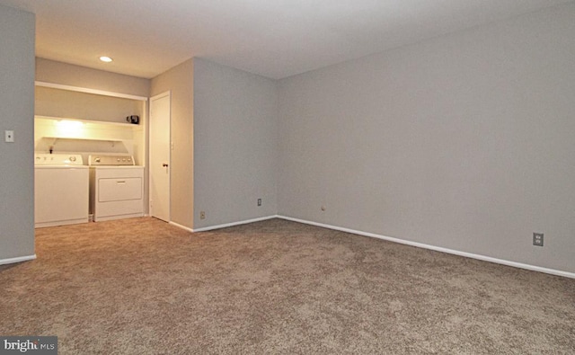 unfurnished bedroom with washer and clothes dryer and carpet flooring