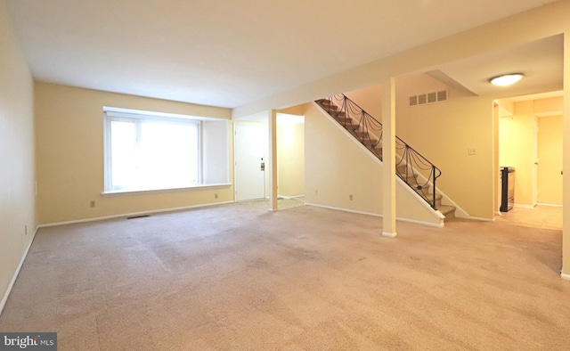 spare room with light colored carpet