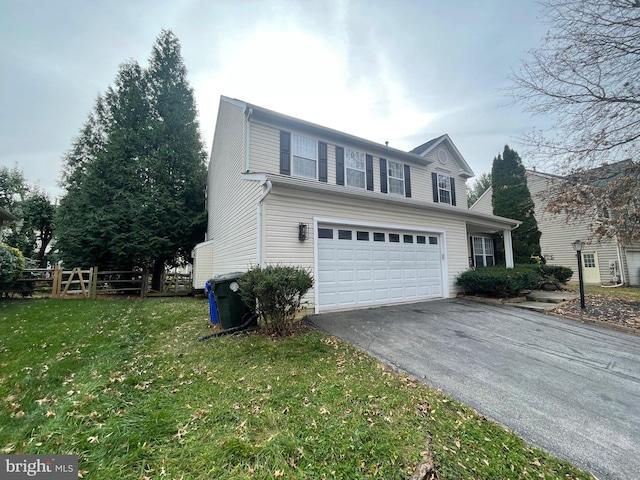 view of front of property with a garage and a front lawn