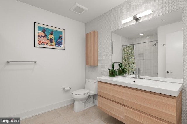 bathroom with tile patterned flooring, vanity, toilet, and walk in shower