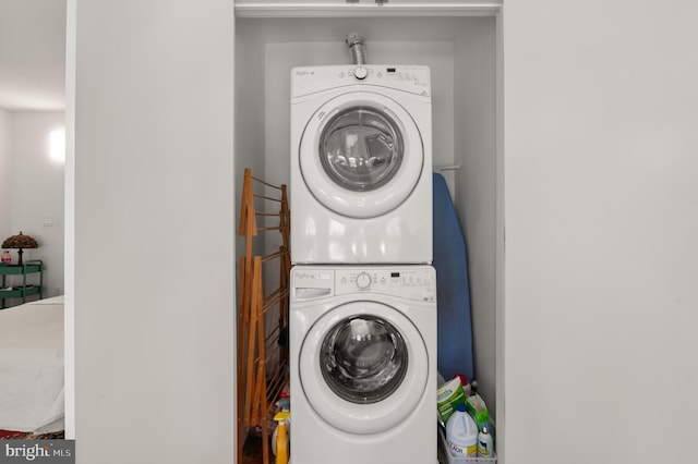 washroom with stacked washer and clothes dryer