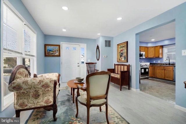 2396 Elvans Rd SE, Washington, DC 20020 - living room with recessed lighting, light wood finished floors, and baseboards