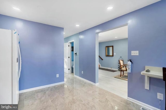 2396 Elvans Rd SE, Washington, DC 20020 - unfurnished room featuring recessed lighting, stairway, and baseboards
