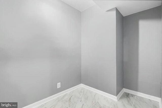 2396 Elvans Rd SE, Washington, DC 20020 - unfurnished room with baseboards and light marble finish floors