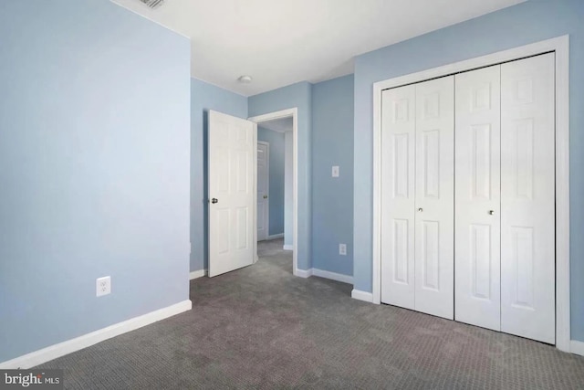 2396 Elvans Rd SE, Washington, DC 20020 - unfurnished bedroom featuring carpet flooring, baseboards, and a closet