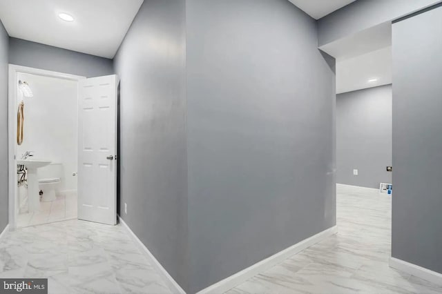 2396 Elvans Rd SE, Washington, DC 20020 - hallway with light marble finish floors, baseboards, and recessed lighting