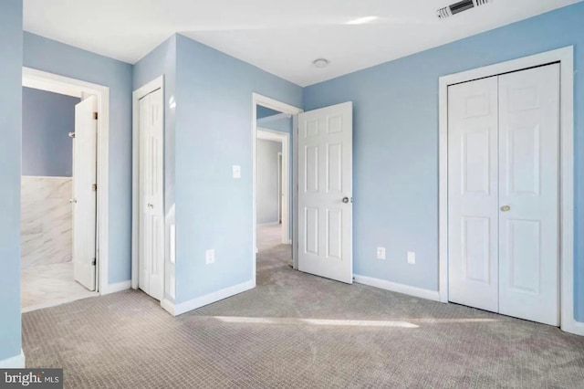 unfurnished bedroom with light carpet