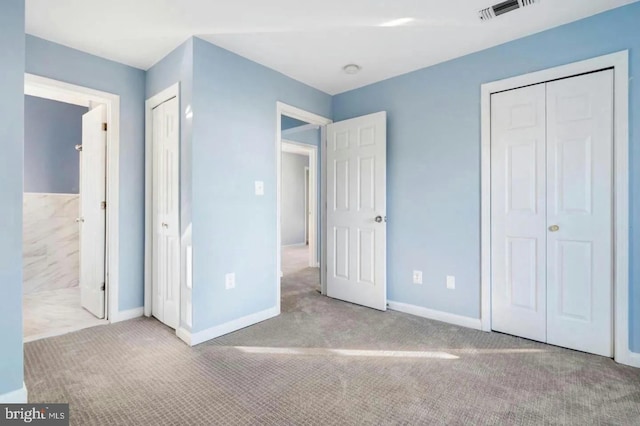 2396 Elvans Rd SE, Washington, DC 20020 - unfurnished bedroom with carpet flooring, baseboards, and ensuite bath