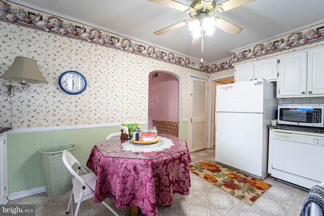 kitchen with white cabinets, white appliances, and ornamental molding