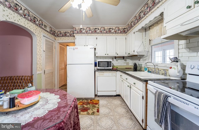 kitchen with ceiling fan, sink, white cabinets, and white appliances