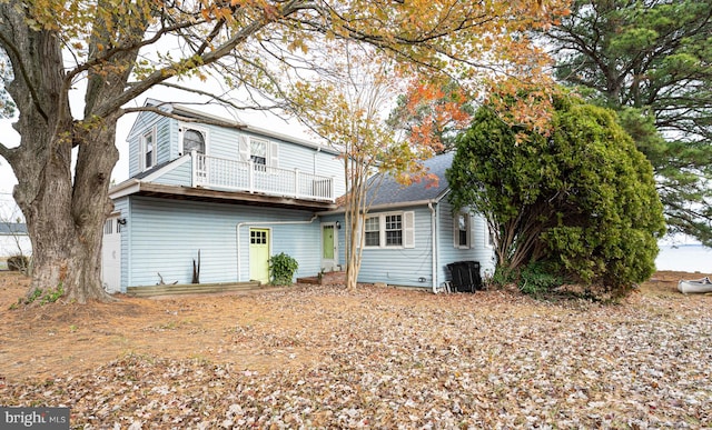 back of house featuring a balcony