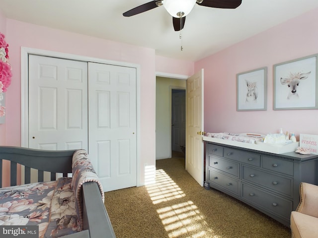 bedroom with dark carpet, a closet, and ceiling fan