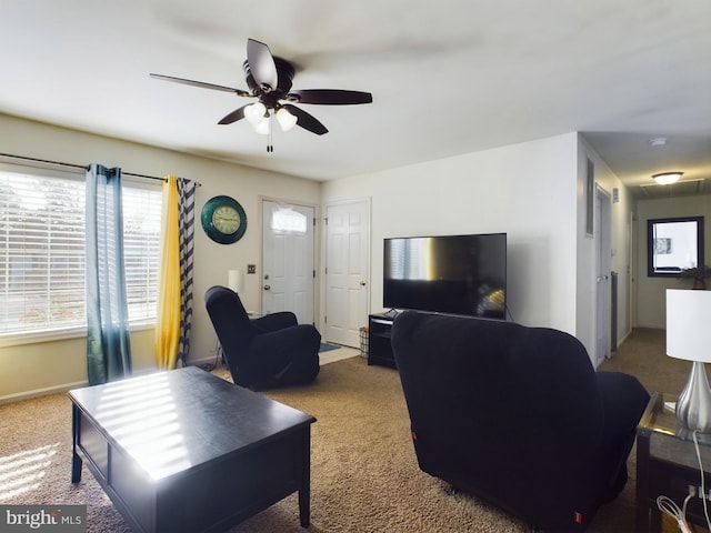 living room with carpet flooring and ceiling fan