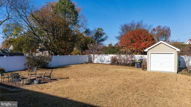 view of yard with an outdoor structure and a garage